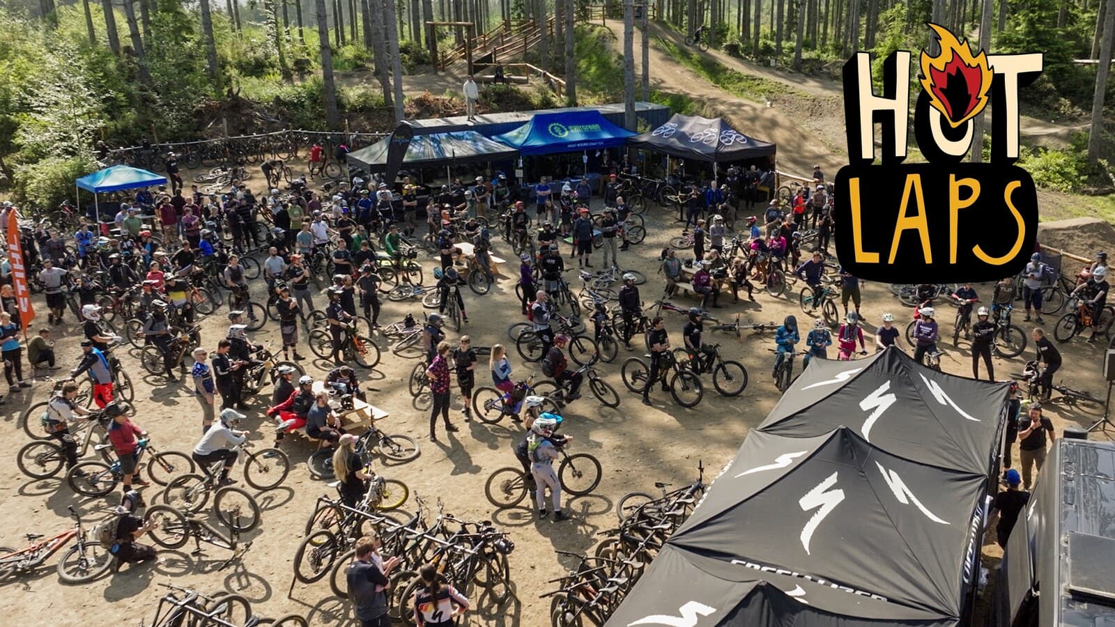 Hotlaps MTB — rider sending a jump at Port Gamble